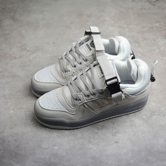 White sneakers with black accents on a gray surface