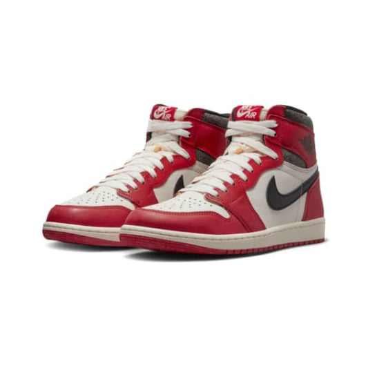 Red and white sneakers with a black logo on a white background