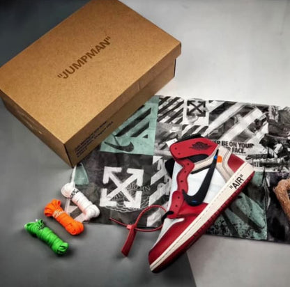 Kith x Nike sneakers with a cardboard box on a gray surface
