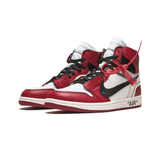 Red and black sneakers with white accents on a white background