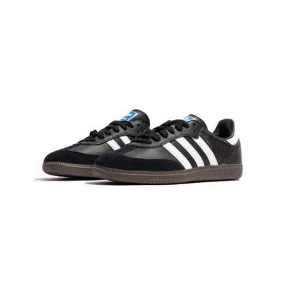 Black Adidas sneakers with white stripes on a white background