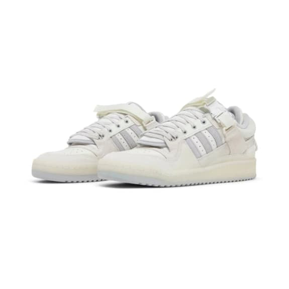 White sneakers with brand logo on a white background