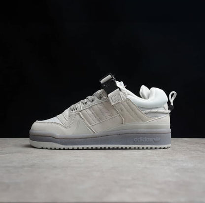 White sneaker on a dark background with a Shopify checkout page overlay.
