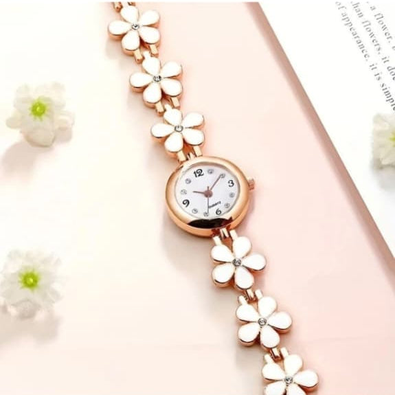 Rose gold floral watch on a white background